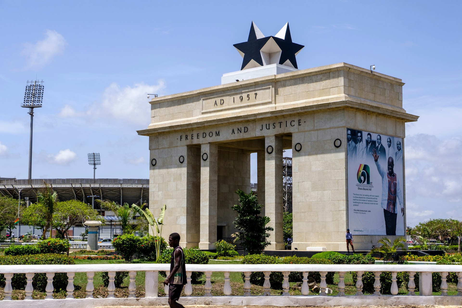 A man walks past the arch of Black Star Gate, symbol of freedom and part of Independence Square in Accra, Ghana, West Africa